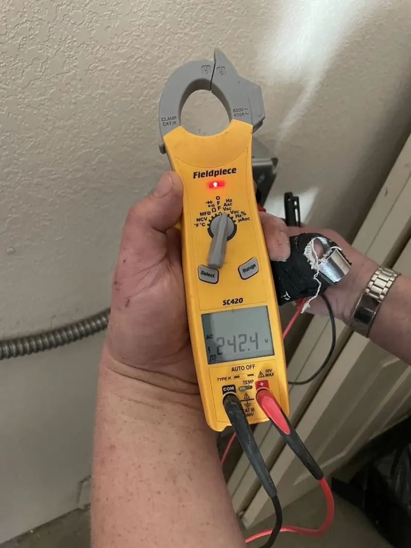 Voltage testing with clamp meter during Aluminum Wiring Replacement in Barton Creek